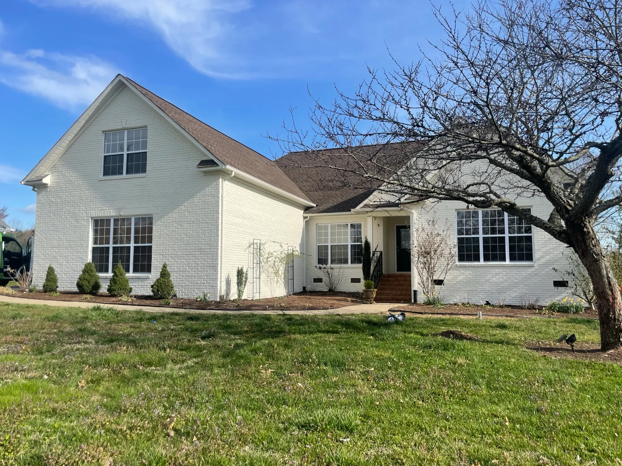 Repainted white brick home exterior in Williamson County, TN